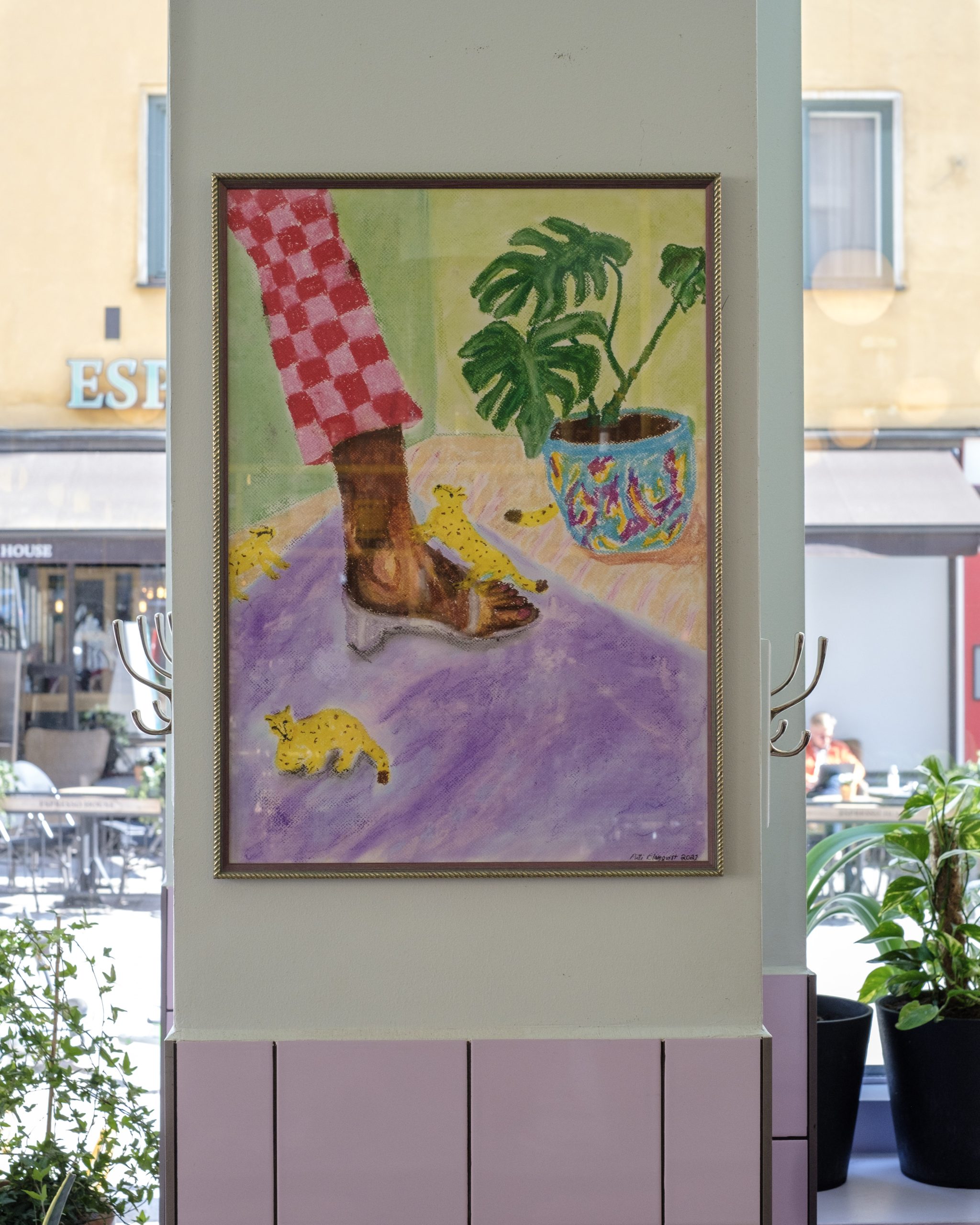 A picture of the artwork on the wall.