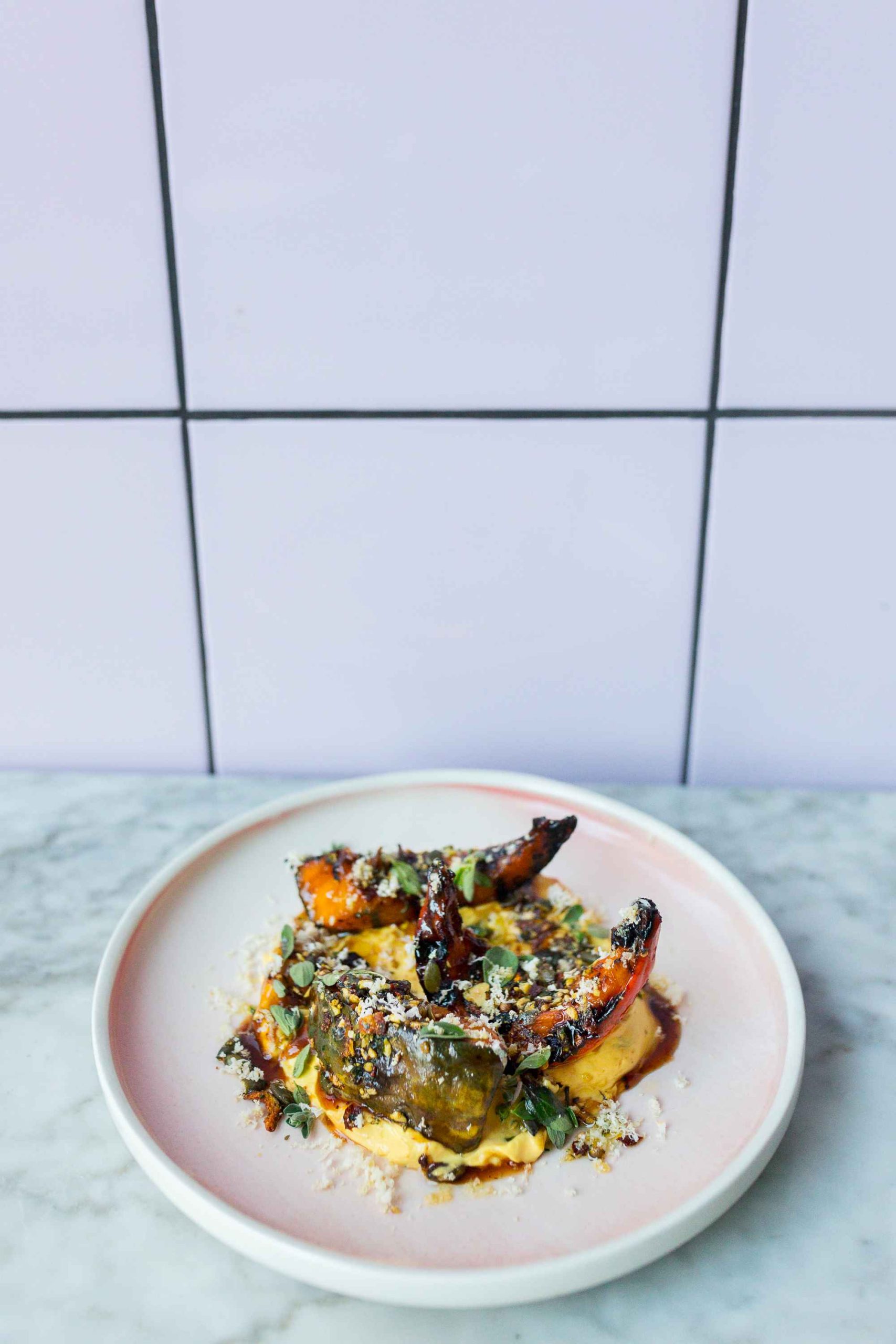 Grilled pumpkin, saffron hollandaise, miso glaze, horseradish, marjoram